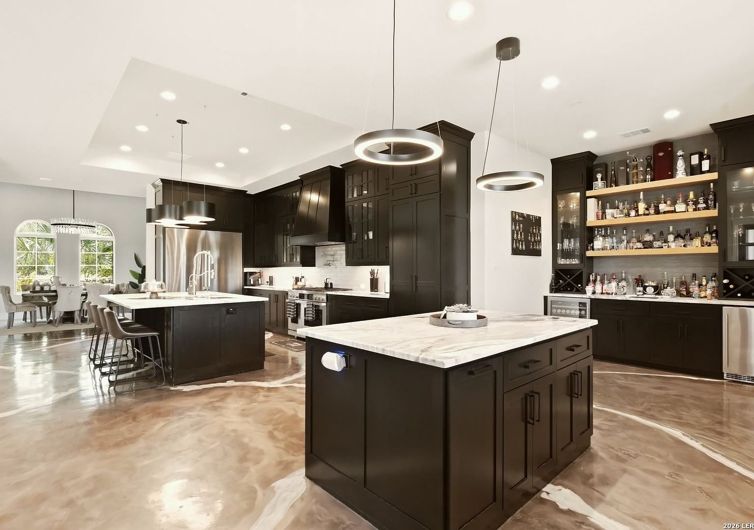 Kitchen with espresso cabinetry and marble island