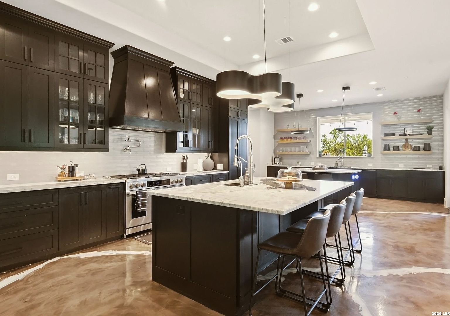 Chef's kitchen with two islands and espresso cabinetry