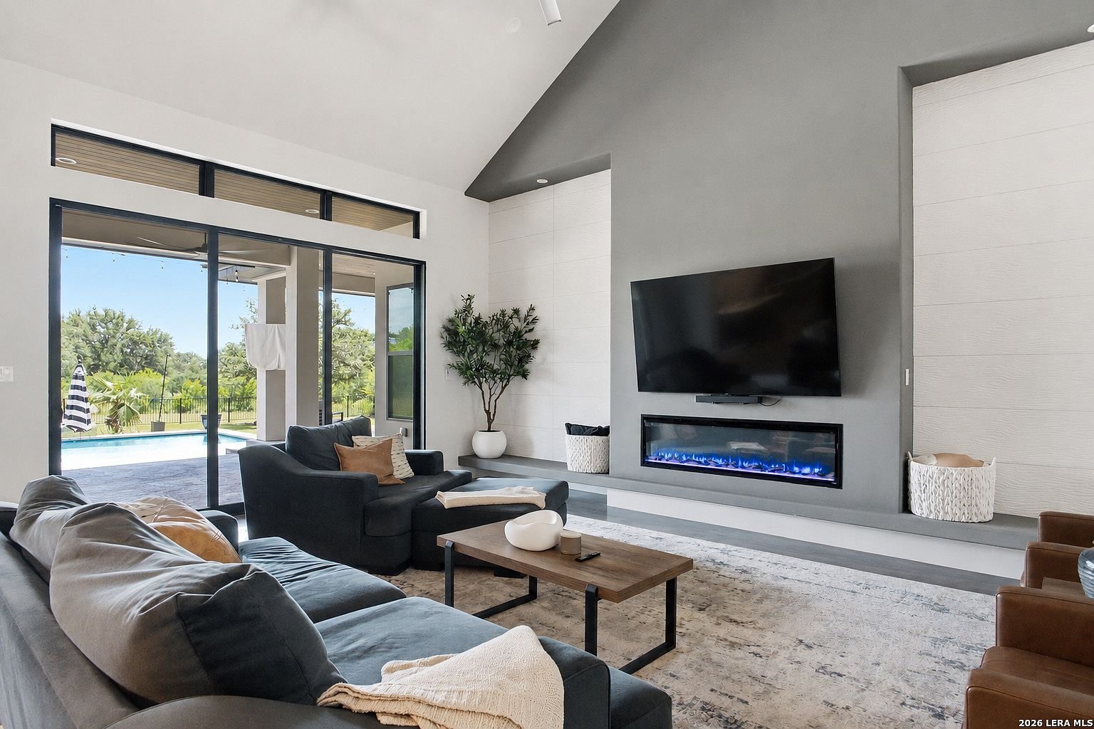 Living room with fireplace and vaulted ceiling