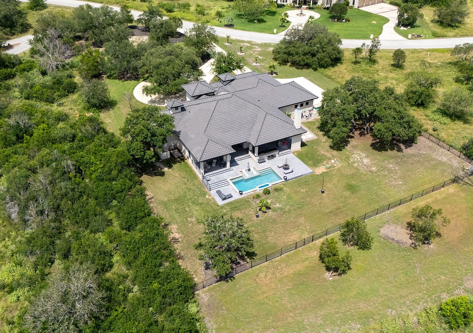 Aerial view of the estate, pool and acreage
